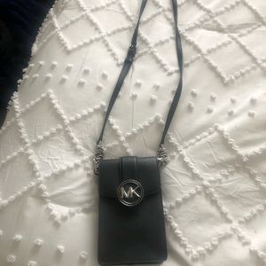 Never been used Michael Kors black and silver chain cross body phone bag.